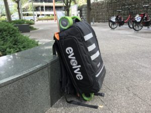 evolve backpack with skateboard attached